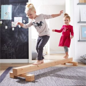kids playing with balance beam