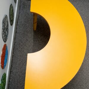 Circular classroom table with colorful chairs designed for special needs students